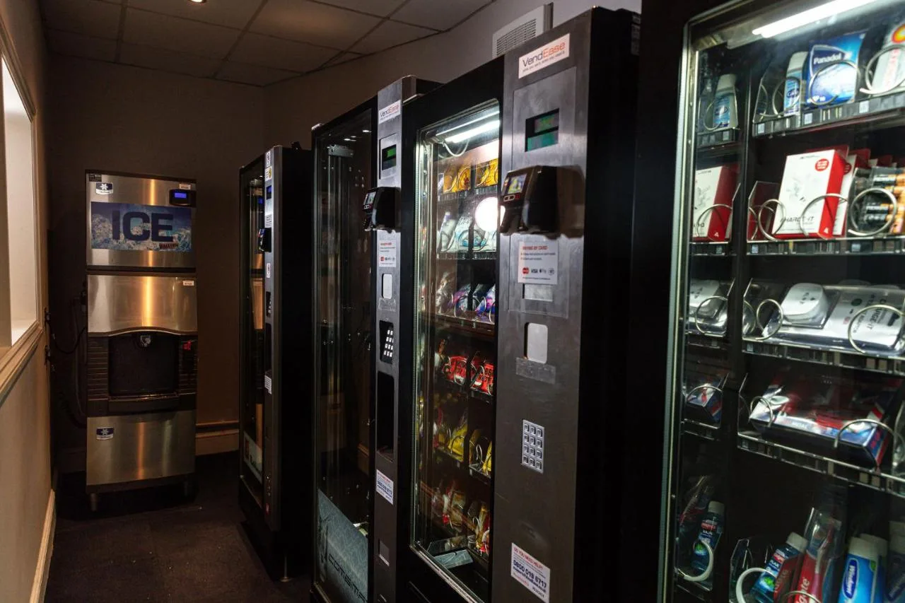 a room with several vending machines in a store at Strand Palace in London